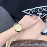 Guess Cubed Analog Gold Dial Gold Steel Strap Watch For Women - GW0606L2 Authentic Buy Shop Now
